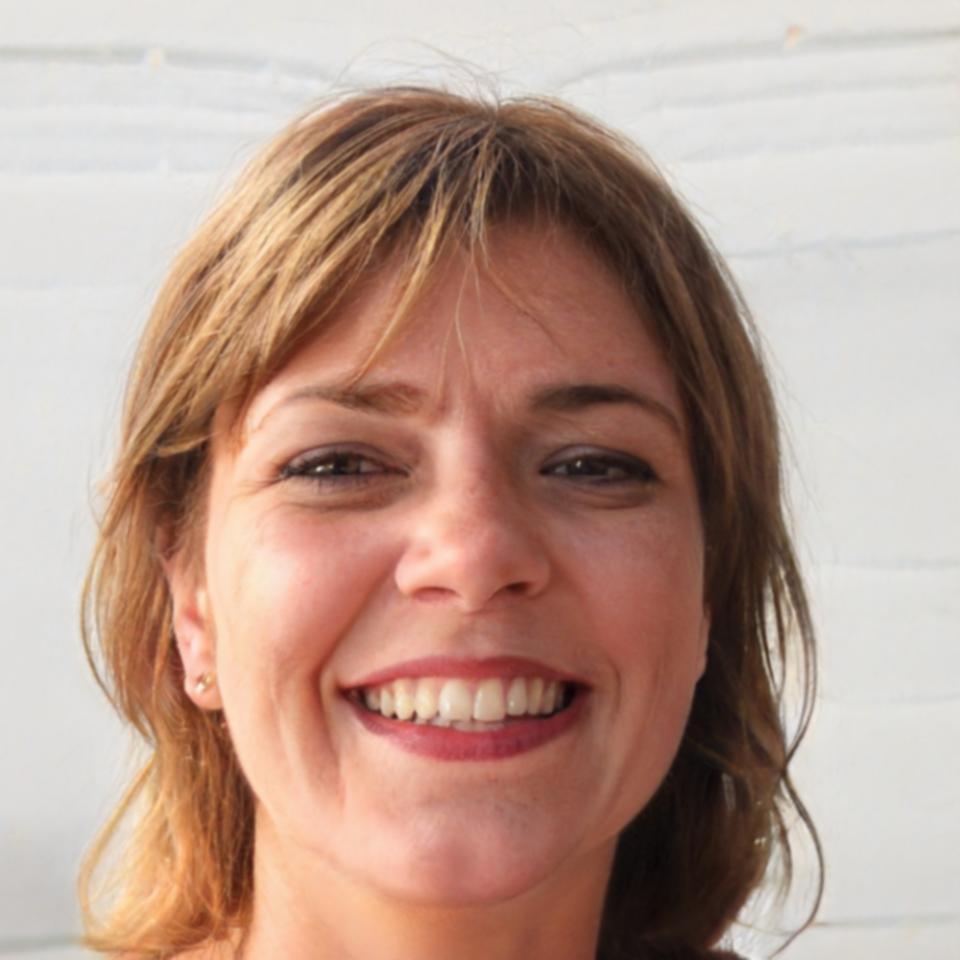 Financial planning consultant reviewing budget documents with positive expression